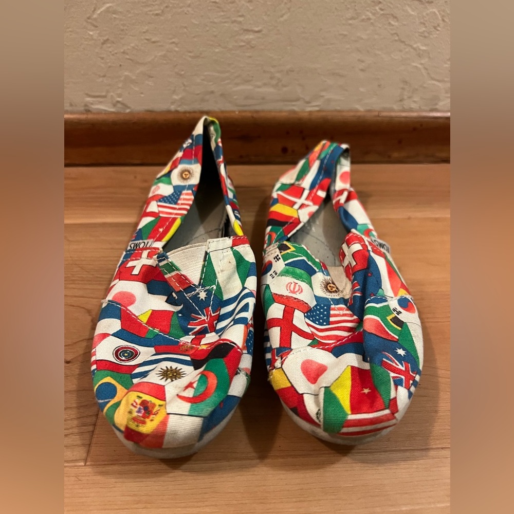 Well worn TOMS shoes